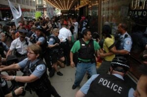 Police tangle with protesters at ALEC's 40th Annual Meeting at the Palmer House Hotel in Chicago in August.