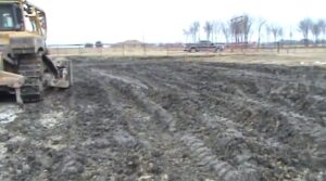 Drilling mud containing hydrocarbons and sewage spread on pasture by Aruba Petroleum, after a landowner wrote to Aruba's president demanding the waste pit on his property be removed. They promised the landowner that the contents of the pit would be "hauled away." They hauled it 200 feet. (Photo: YouTube)