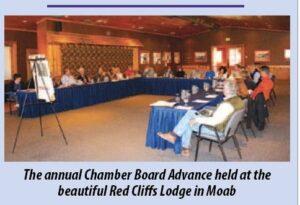 Photo of Chamber Board meeting at a lodge in Utah, printed in the Daily Sentinel.