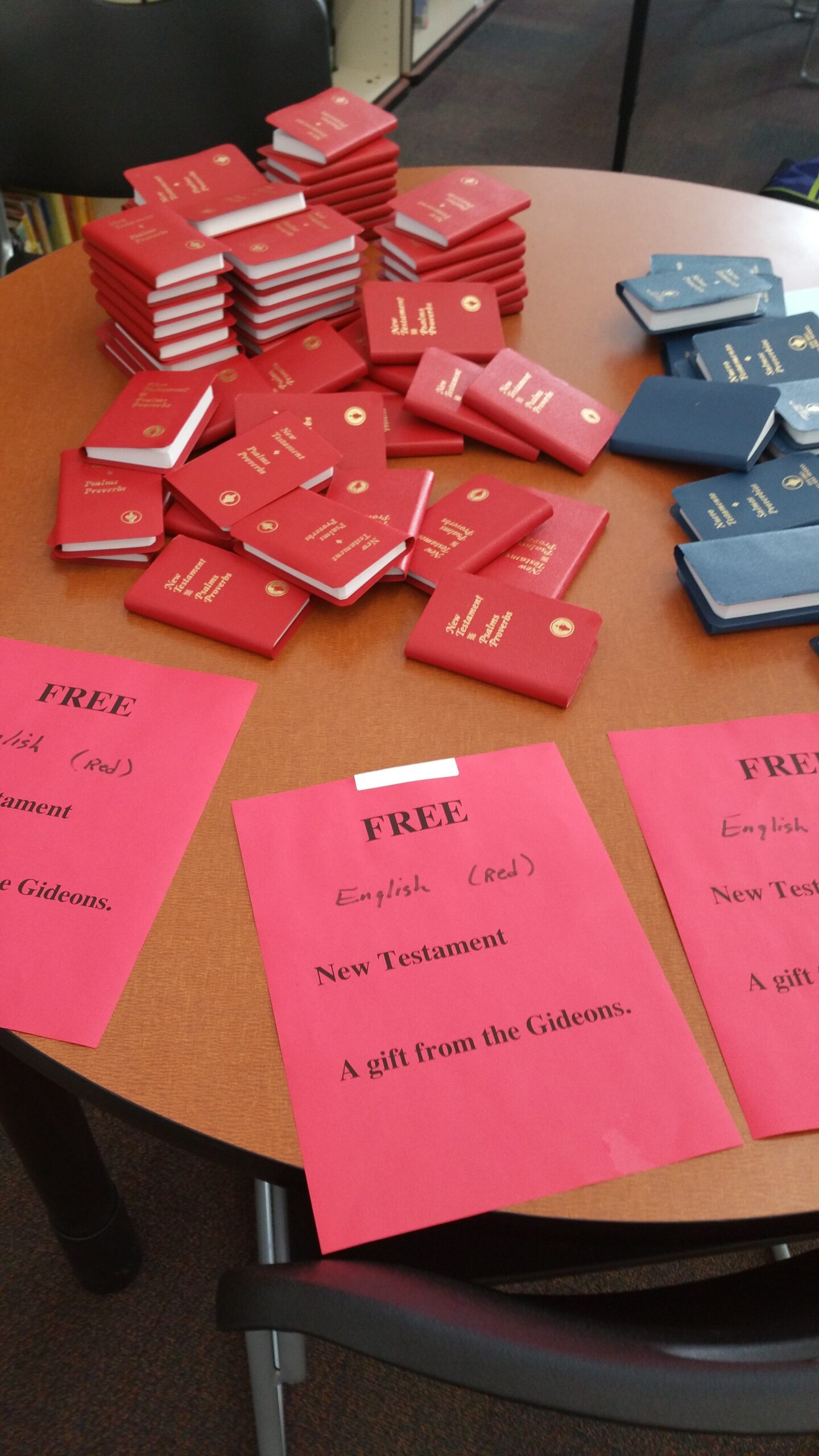 Gideon Bibles piled on a table at the entrance/exit to the Delta Middle School library December 18, 2015