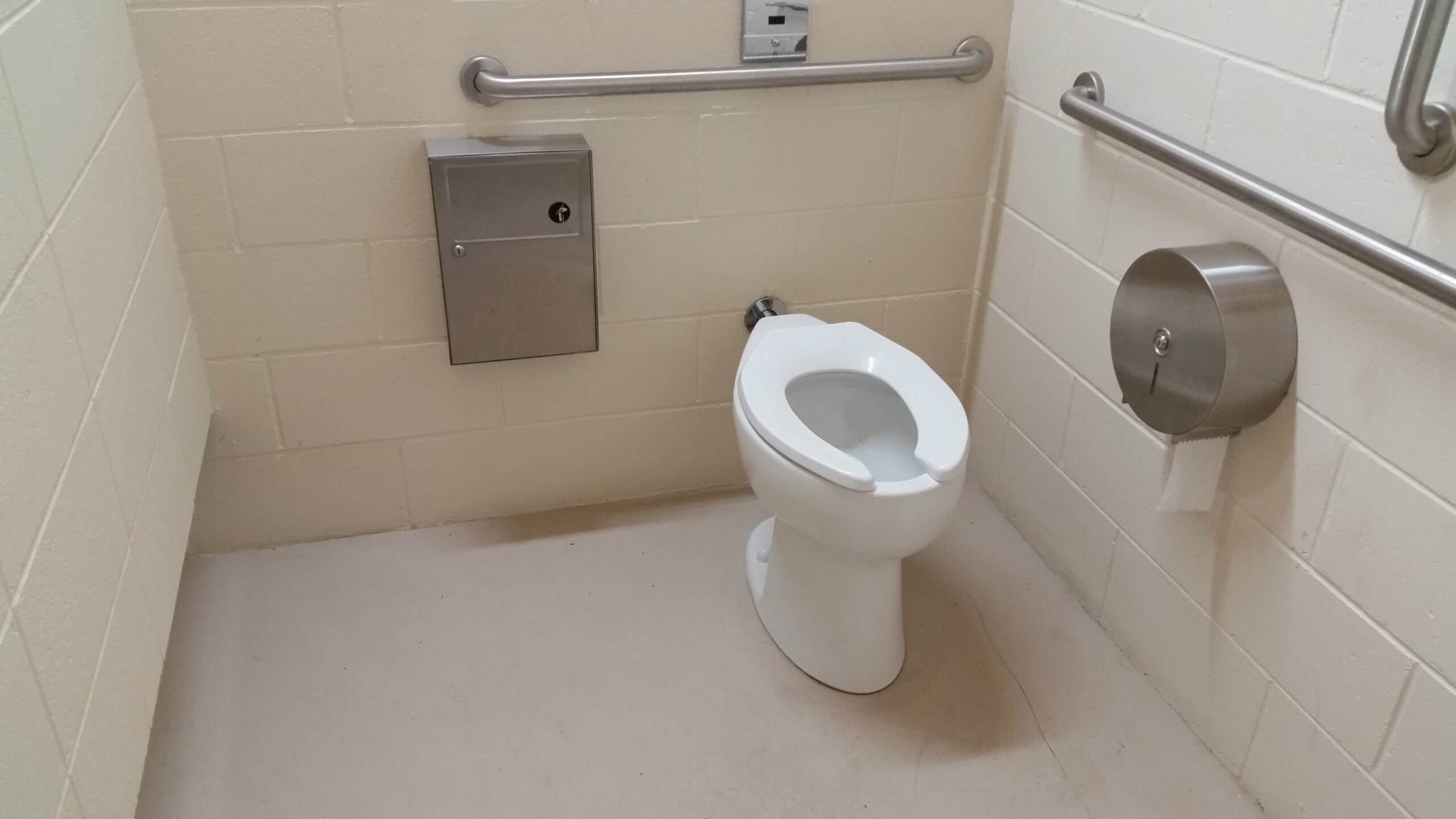 Handicap stall - spacious, clean, brightly lit and...automatically flushing toilets