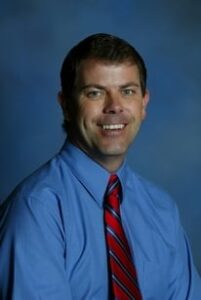District Attorney Pete Hautzinger, of the 21st Judicial District (Mesa County), charged beleaguered former juror Marilyn Charlesworth with contempt, is threatening her with jail time and is now trying to make her pay for Blagg's new trial