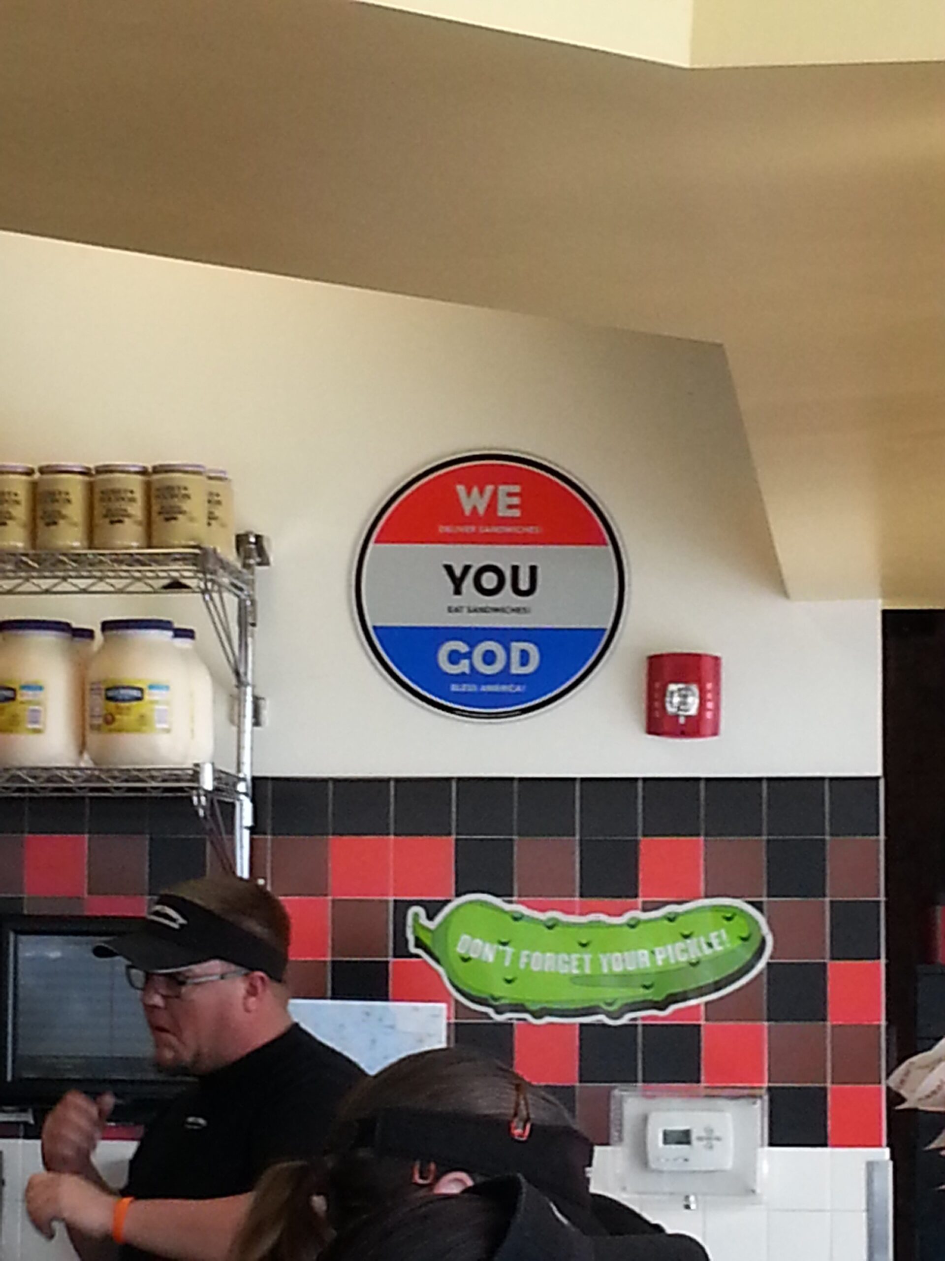 Jimmy John's "God" sign, alongside a giant pickle