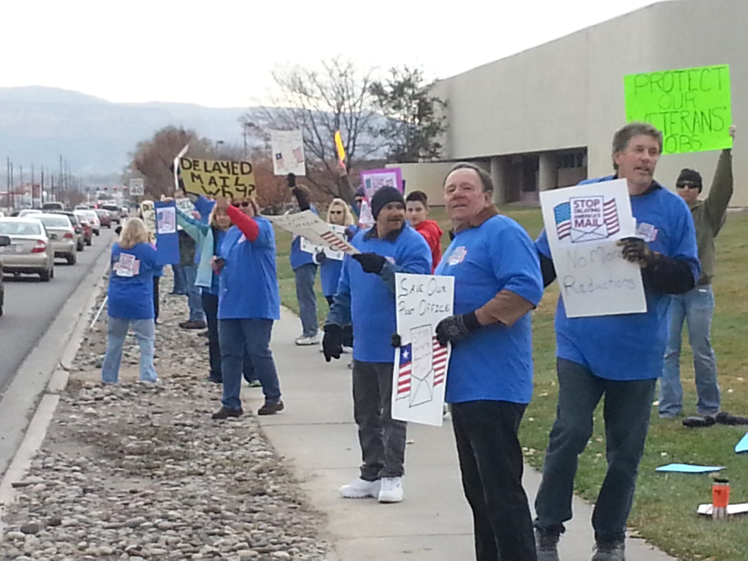 Supporters of the U.S. Post Office in Grand Junction protest further cutbacks at the Patterson Road mail sorting facility on Friday, Nov. 14th.