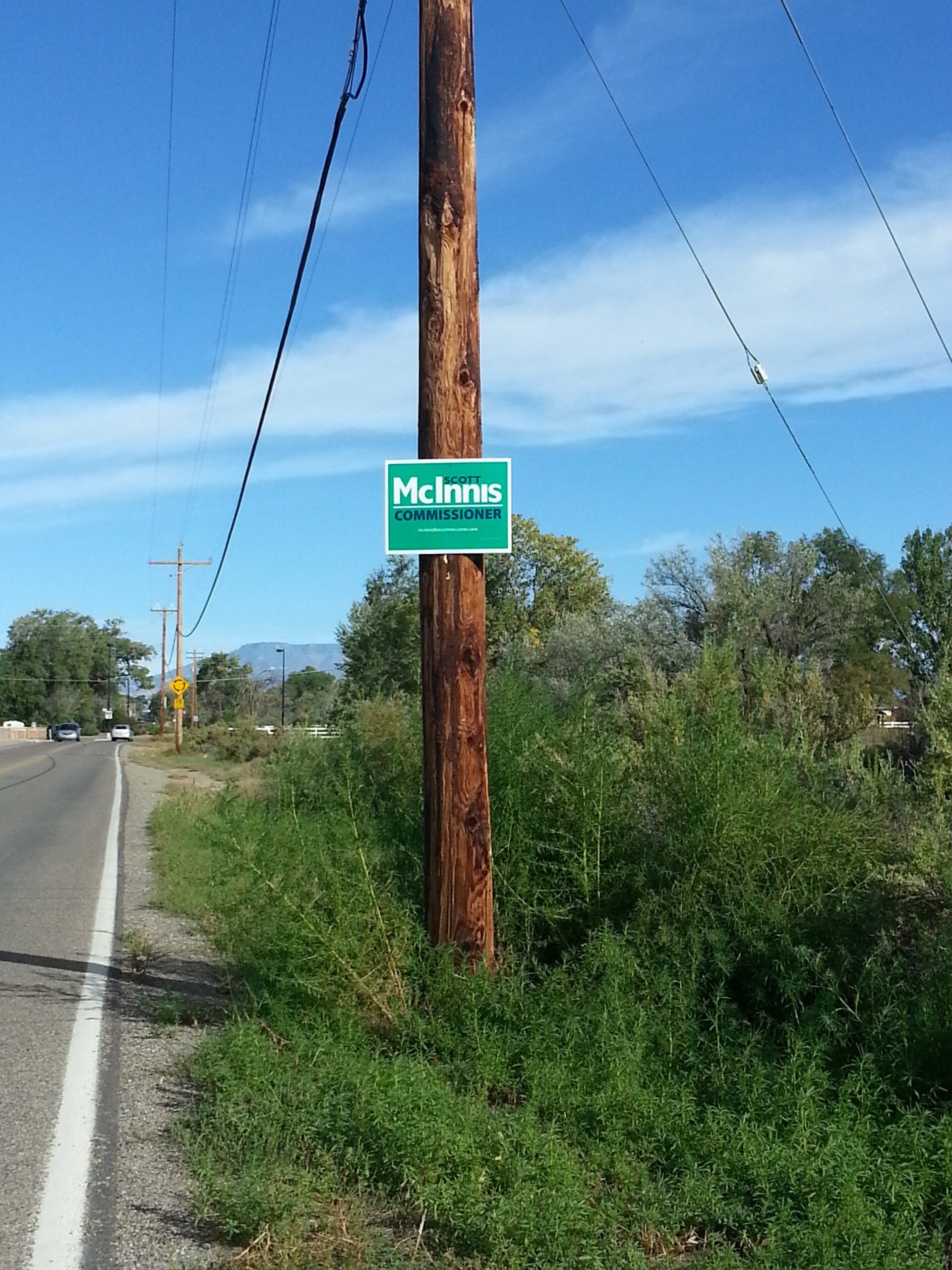 Illicitly-placed "McInnis" campaign sign on a power pole along G Road, placed without permission from XCel. The McInnis campaign has been asked to remove the signs.