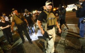 Armed "Oath Keepers" roamed the streets of Ferguson, MI, exacerbating residents' unease after the death of Michael Brown