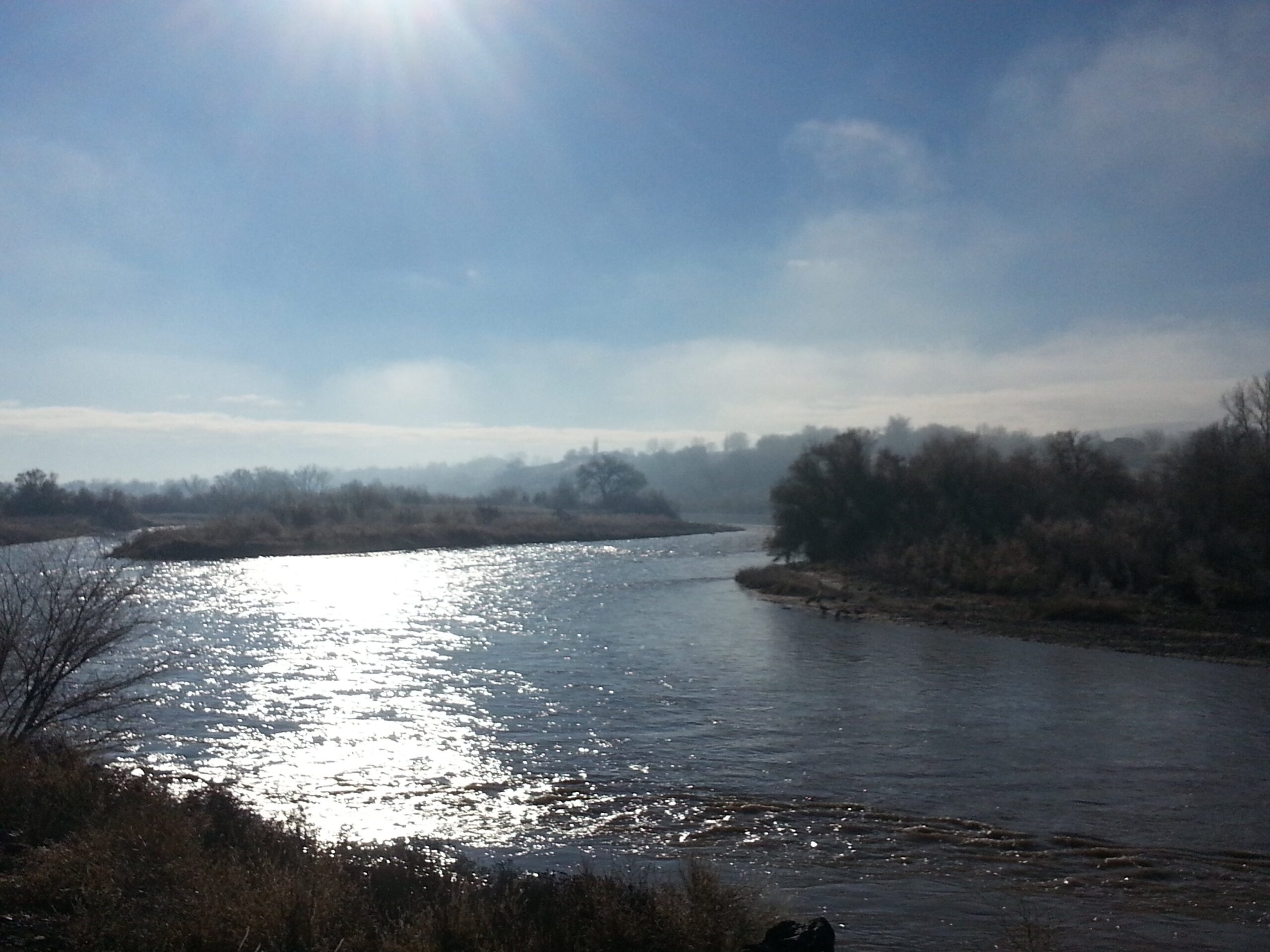 The morning sun glistens on the Colorado River on the Monument View section, where hunters are allowed to shoot at birds in the very same vicinity where paths beckon people to run, walk and bike by to the river.