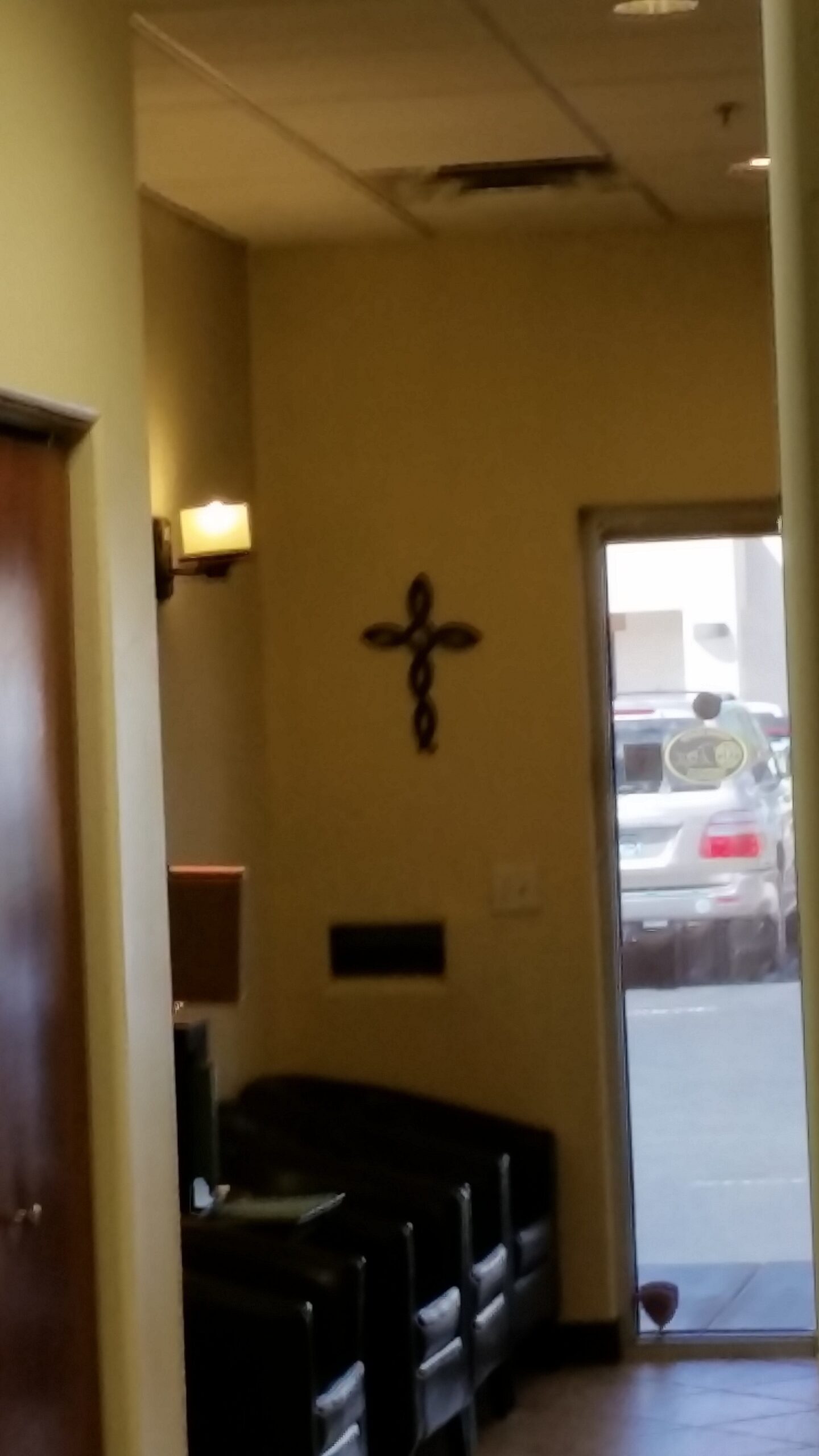 A cross on prominent display in a local chiropractic office