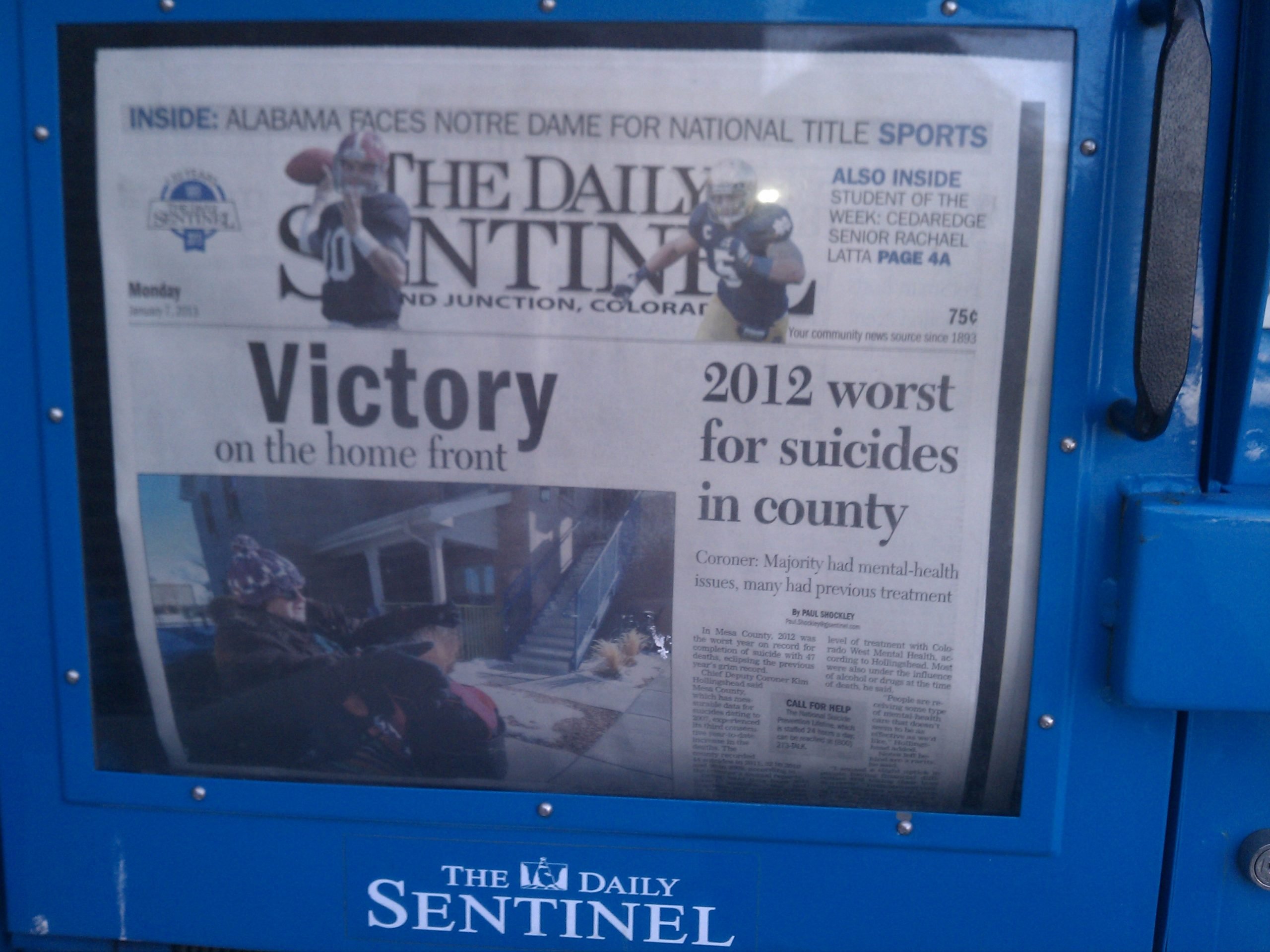 The Grand Junction (CO) Daily Sentinel failed to catch this embarrassing juxtaposition of headlines. 