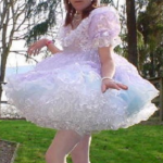 An adult male wearing Sissy Baby clothing