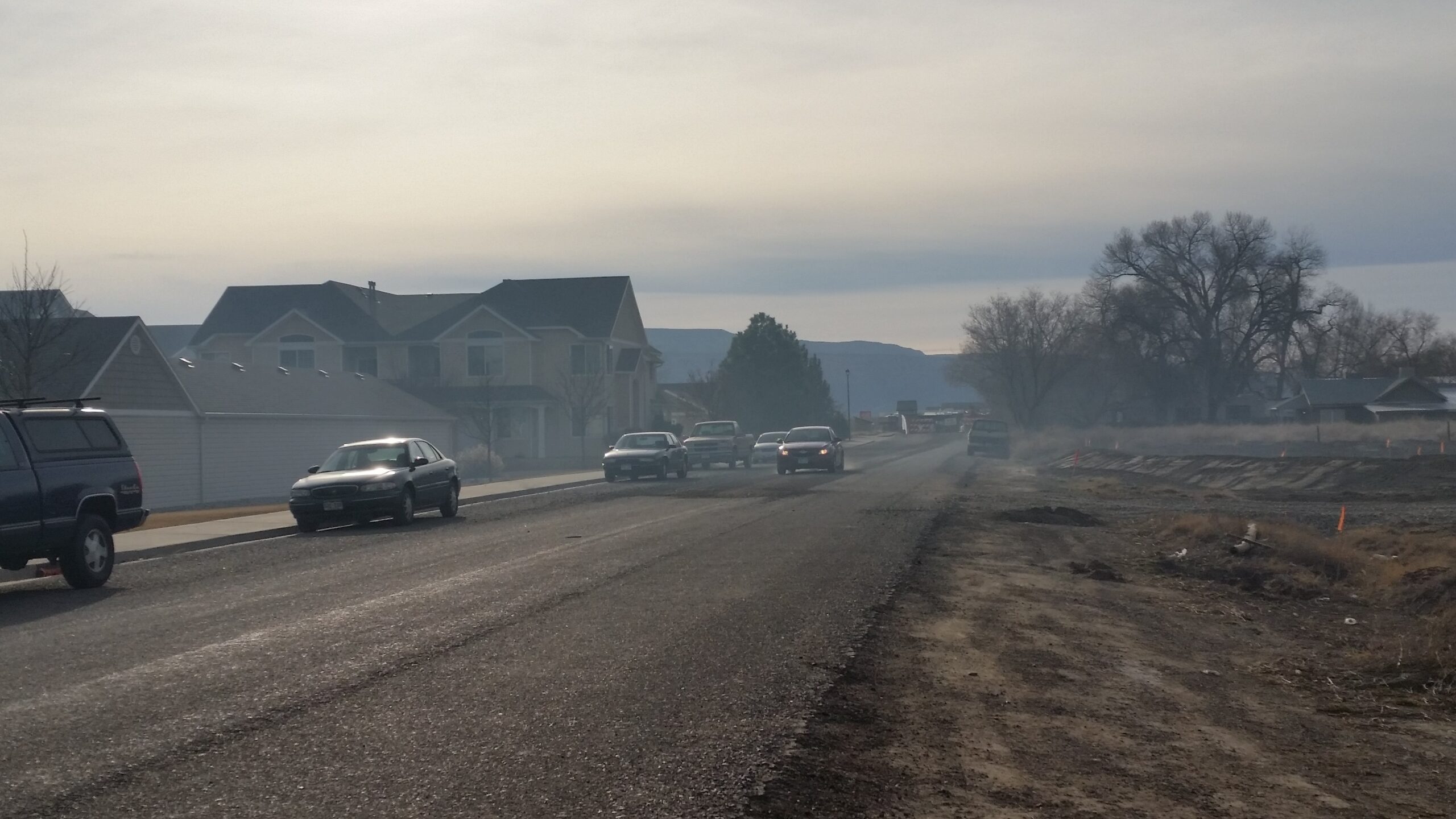 Smoke from an open burning fire smothered an entire neighborhood one spring afternoon just 1/4 mile from Mesa Mall. 