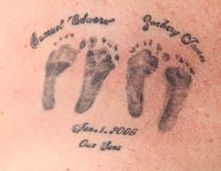 A tattoo the widower in the Colorado case got of his unborn sons’ footprints and names. (Photo credit: Westword)