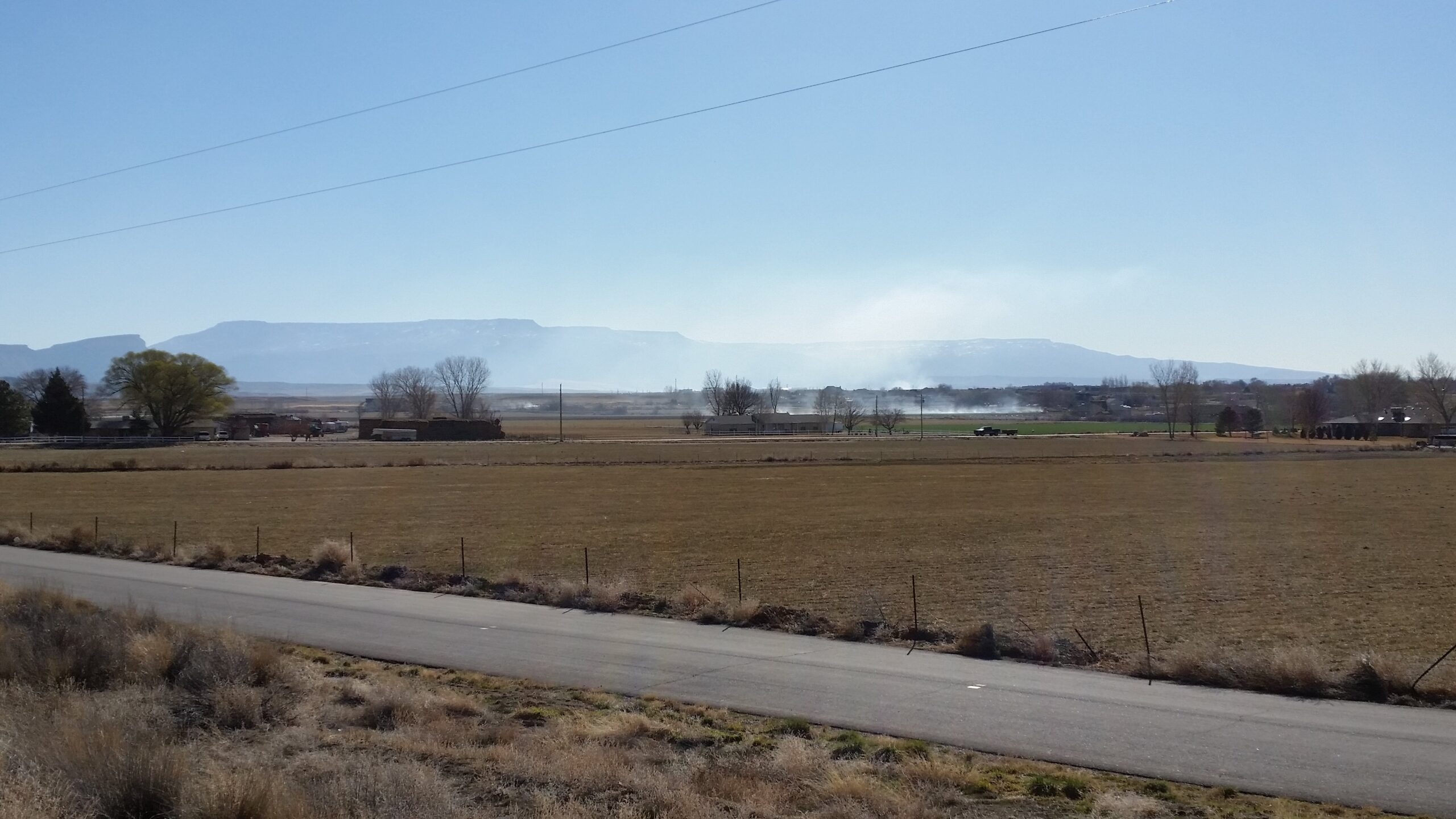 Open burning fills the valley air with haze and envelopes entire neighborhoods